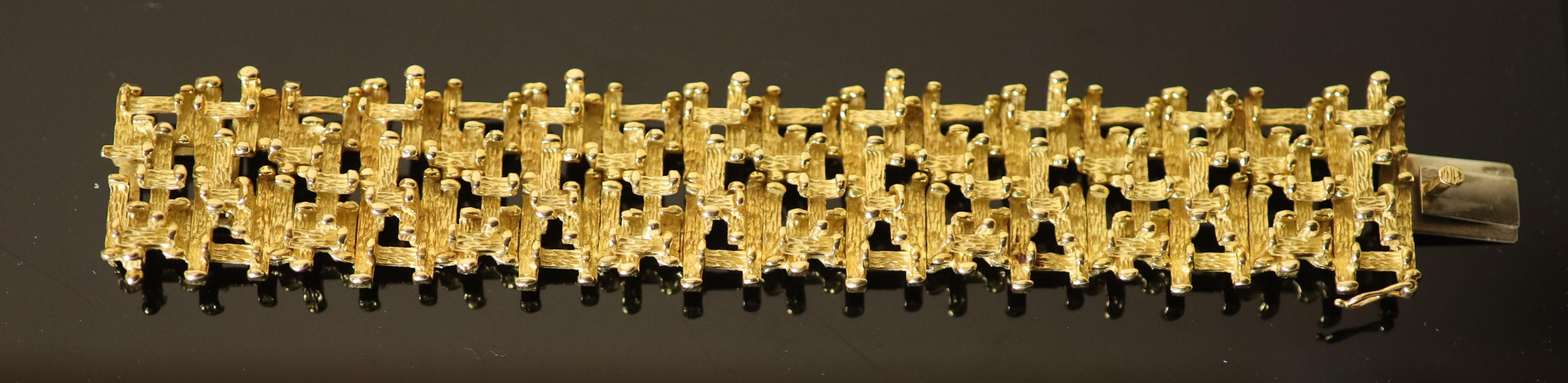 An early 1970s 18ct gold modernist rustic bracelet by Alan Martin Gard,